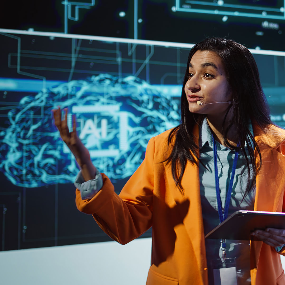 public-speaker-doing-presentation-tech-forum-event